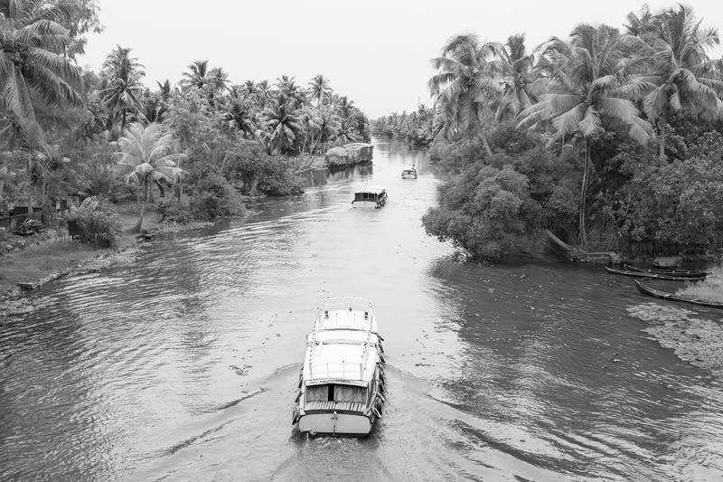 Agriculture and other livelihoods below the Sea Level in Kuttanad, Alappuzha district, Kerala - plying motorized tourist boats in the local waterways